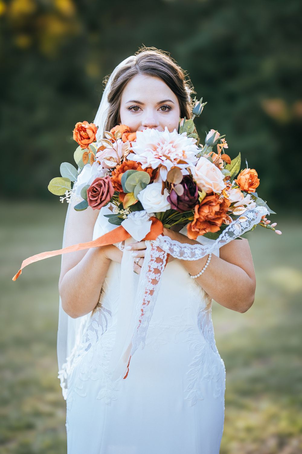 Bride with autumn floral bouquet